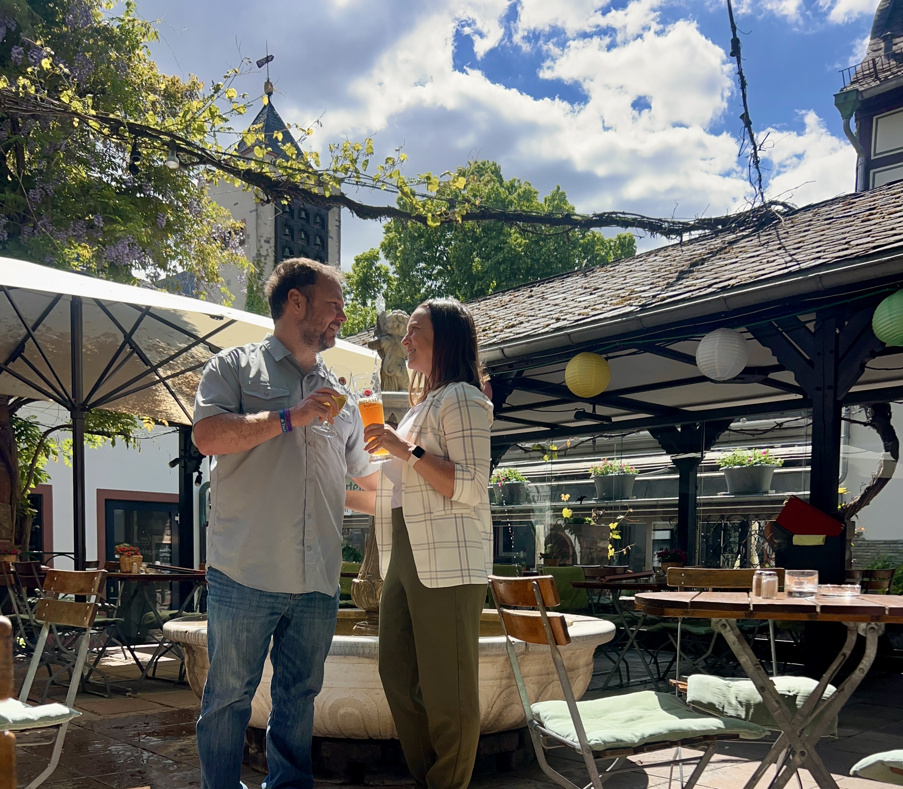 Couple Enjoying beer in a beer garden on a sunny day