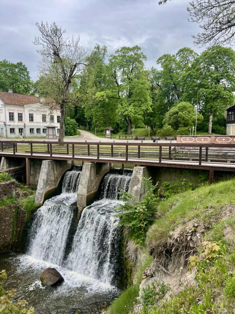 Double waterfall under a bridge in the town